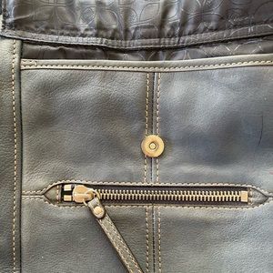 Blue pebbled cross body Fossil purse.11” long, 11” wide,